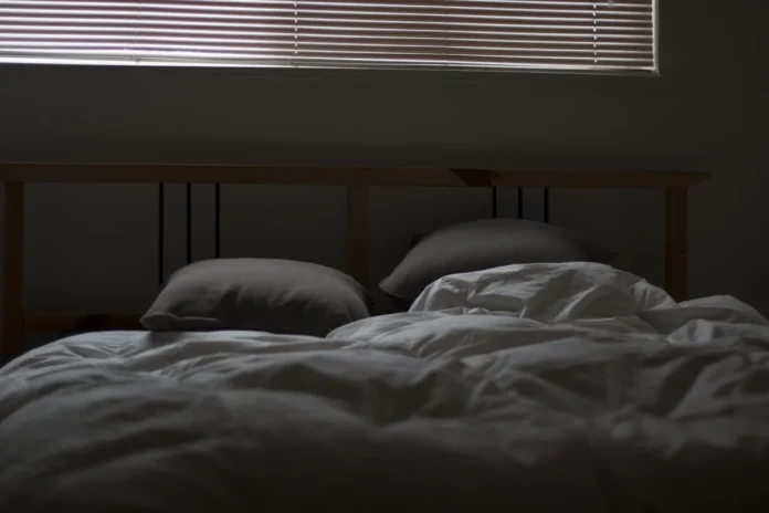 bipolar medication that helps with sleep - Messy bed and closed blinds
